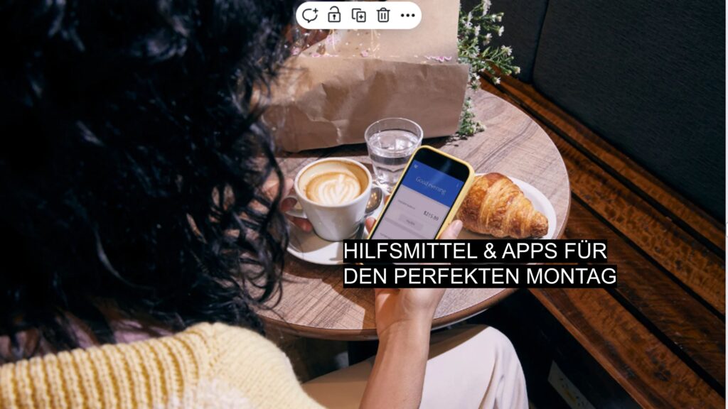 Frau sitzt im Café mit Cappuccino und Croissant, schaut auf ihr Smartphone mit geöffneter App.