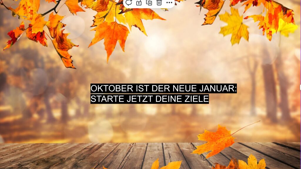 Herbstliche Blätter und Holzboden mit Text: Oktober ist der neue Januar – starte im Herbst deine Ziele